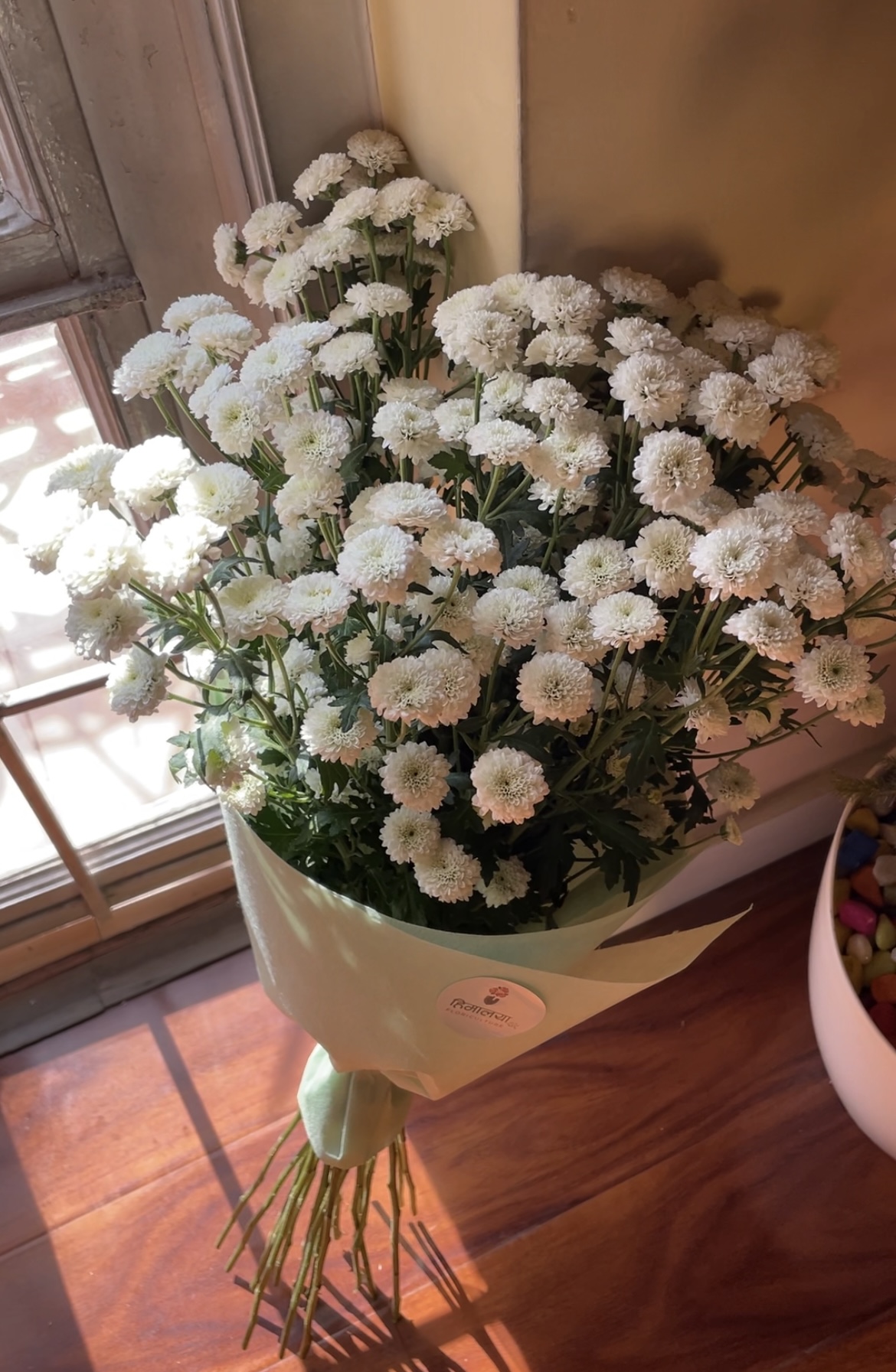 The Bottom Daisy Bouquet is a cheerful arrangement featuring fresh daisy flowers known for their simple beauty and bright appearance. Symbolizing happiness, innocence, and new beginnings, this bouquet brings a fresh and positive touch to any occasion.