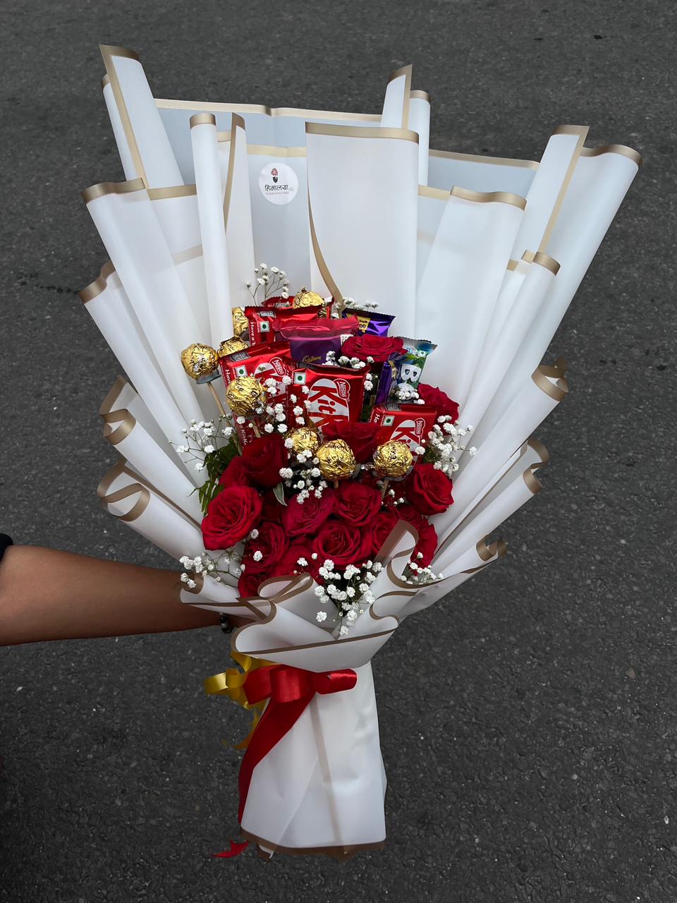 Modern hand-tied fusion bouquet wrapped in luxury presentation paper and finished with an accent ribbon.