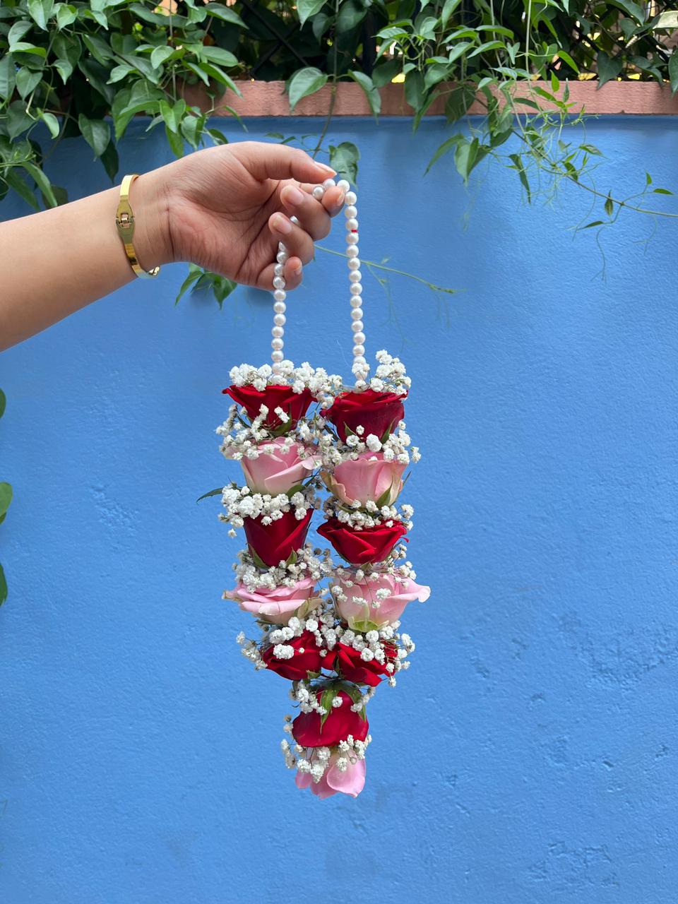 Make your baby's Rice Feeding Ceremony unforgettable with our fresh red and pink rose Pasni garland. Lightweight, baby-safe, and handcrafted for the perfect milestone. Shop now!