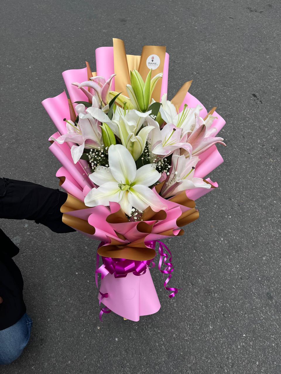 Designed with 5 fresh lily stems, this bouquet showcases the natural beauty and charm of lilies. Its elegant appearance and soothing fragrance make it a classic choice for gifting or adding a touch of freshness to any home or office.