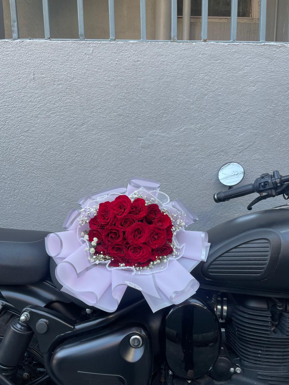 Deliver grand romance with our luxury 35-stem premium red rose bouquet. Expertly hand-tied and encased in high-end structural wrapping. Order fresh today!