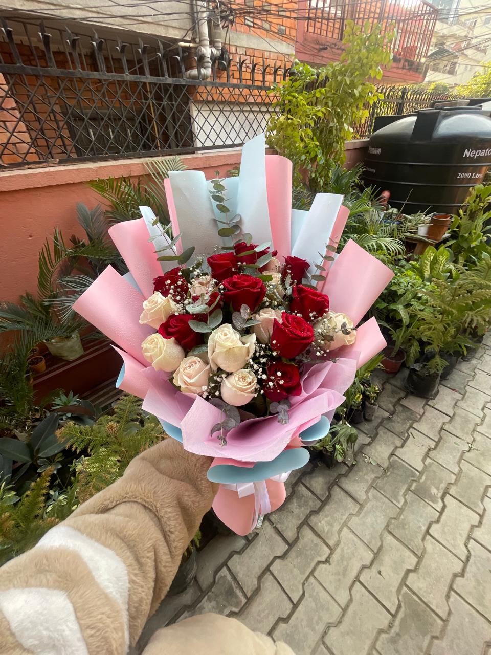 Deliver classic romance with a modern twist. Our handcrafted 20-stem premium red and white rose bouquet features fresh eucalyptus and luxury wrapping. Order today!
