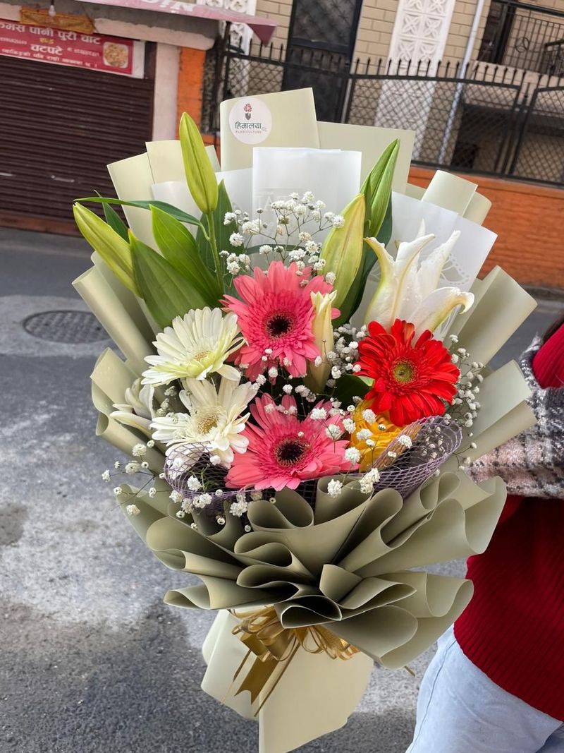 The Radiant Lily & Gerbera Seasonal Arrangement