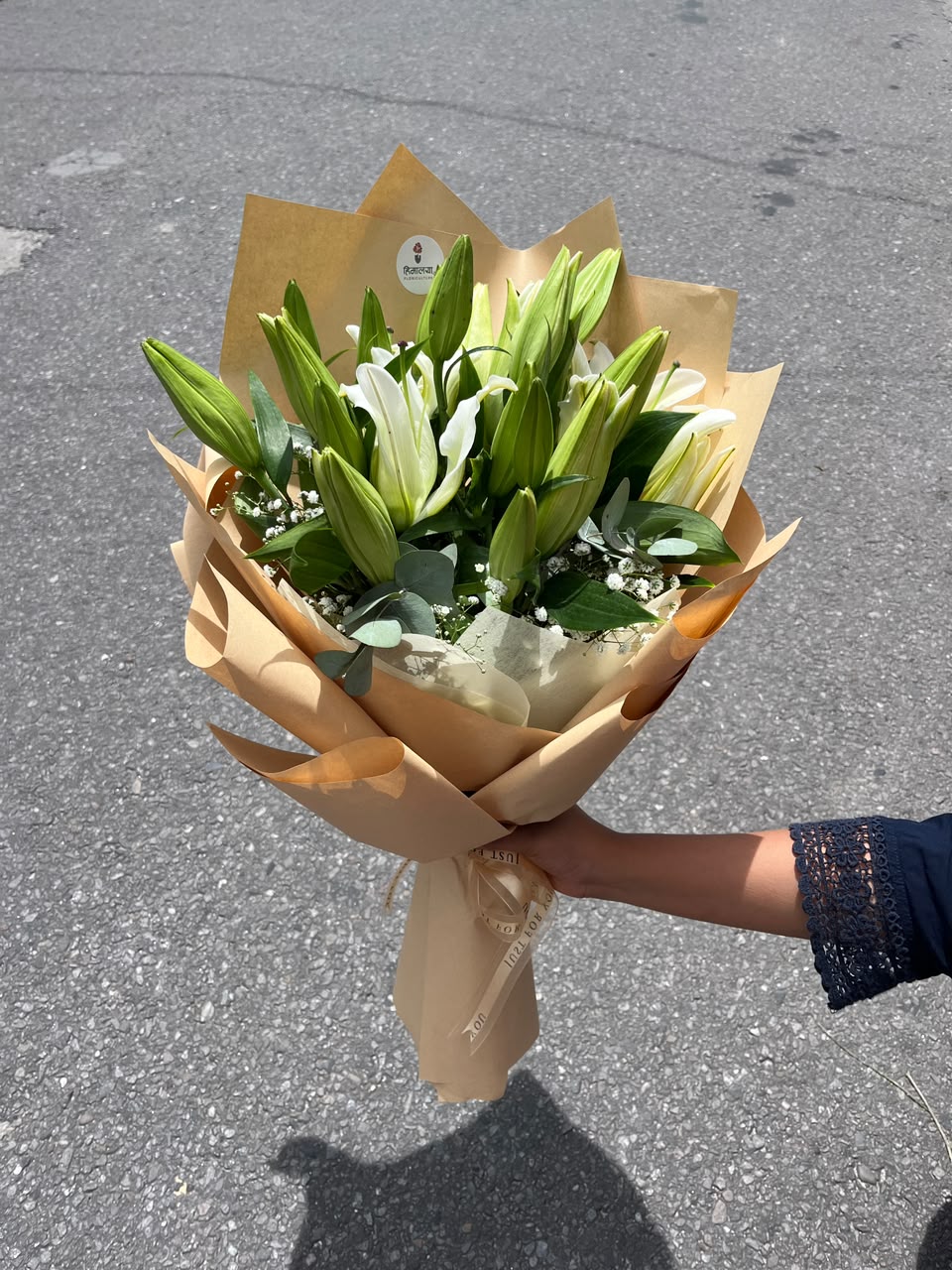 Please note that lilies may arrive in bud form to ensure maximum freshness and a longer-lasting bouquet. The flowers will naturally bloom over the following days, revealing their full beauty and fragrance. Slight variations in flower color, size, and wrapping may occur depending on seasonal availability, while maintaining the overall quality and elegance of the arrangement. To keep your lilies fresh for longer, place them in clean water and remove pollen from fully opened blooms.