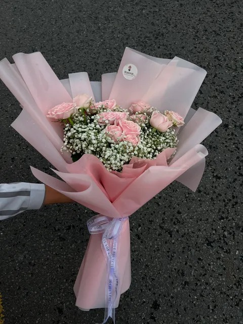 15 Pastel Pink Rose Bouquet Please Note: Since flowers are seasonal, some filler greens or wrapping materials may vary slightly depending on availability. Rest assured, our florists will always maintain the same aesthetic, quality, and value.