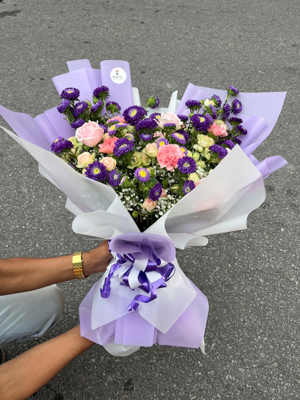 Flower colors, varieties, and arrangement style may vary slightly depending on seasonal availability while maintaining the overall beauty and quality of the bouquet. Keep flowers in fresh water and away from direct sunlight to enjoy longer-lasting freshness.