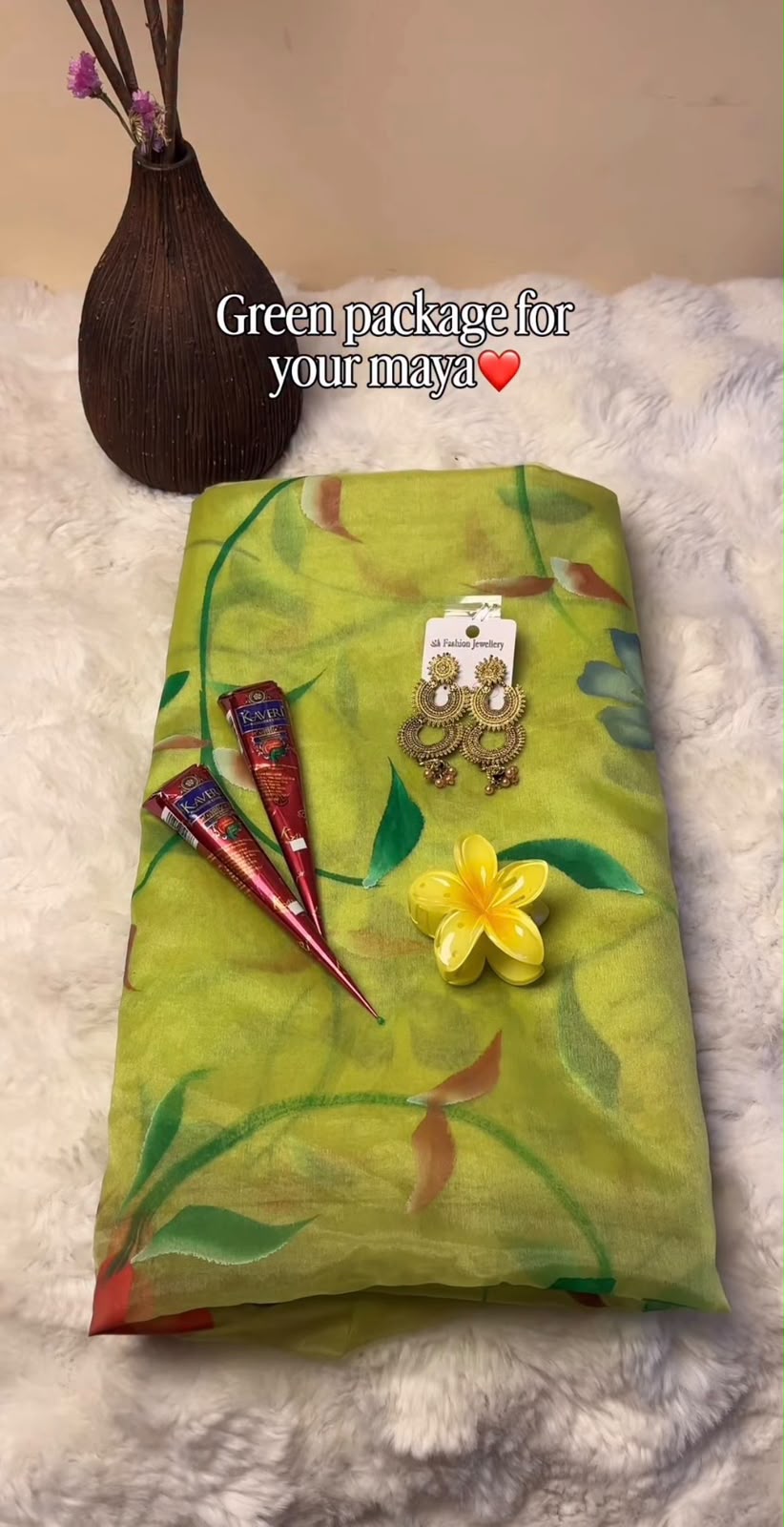 The Shrawan Combo is carefully curated with festive essentials to complement your traditional celebrations. The design of the saree, jhumka earrings, and flower clutcher may vary slightly based on availability while maintaining the overall festive look and quality. This combo is perfect for Shrawan, Teej, religious occasions, and gifting to your loved ones.