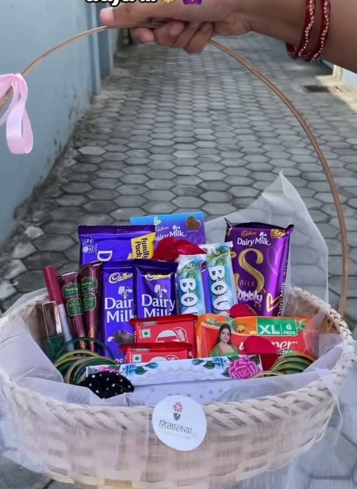 Each Shrawan Combo is carefully arranged in a decorative bamboo basket to create a beautiful festive presentation. Product colors, basket design, chocolate assortment, and accessory styles may vary slightly depending on availability while maintaining the overall quality and festive theme. Please store chocolates in a cool, dry place away from direct sunlight. This combo is perfect for Shrawan, Teej, festive celebrations, and thoughtful gifting.