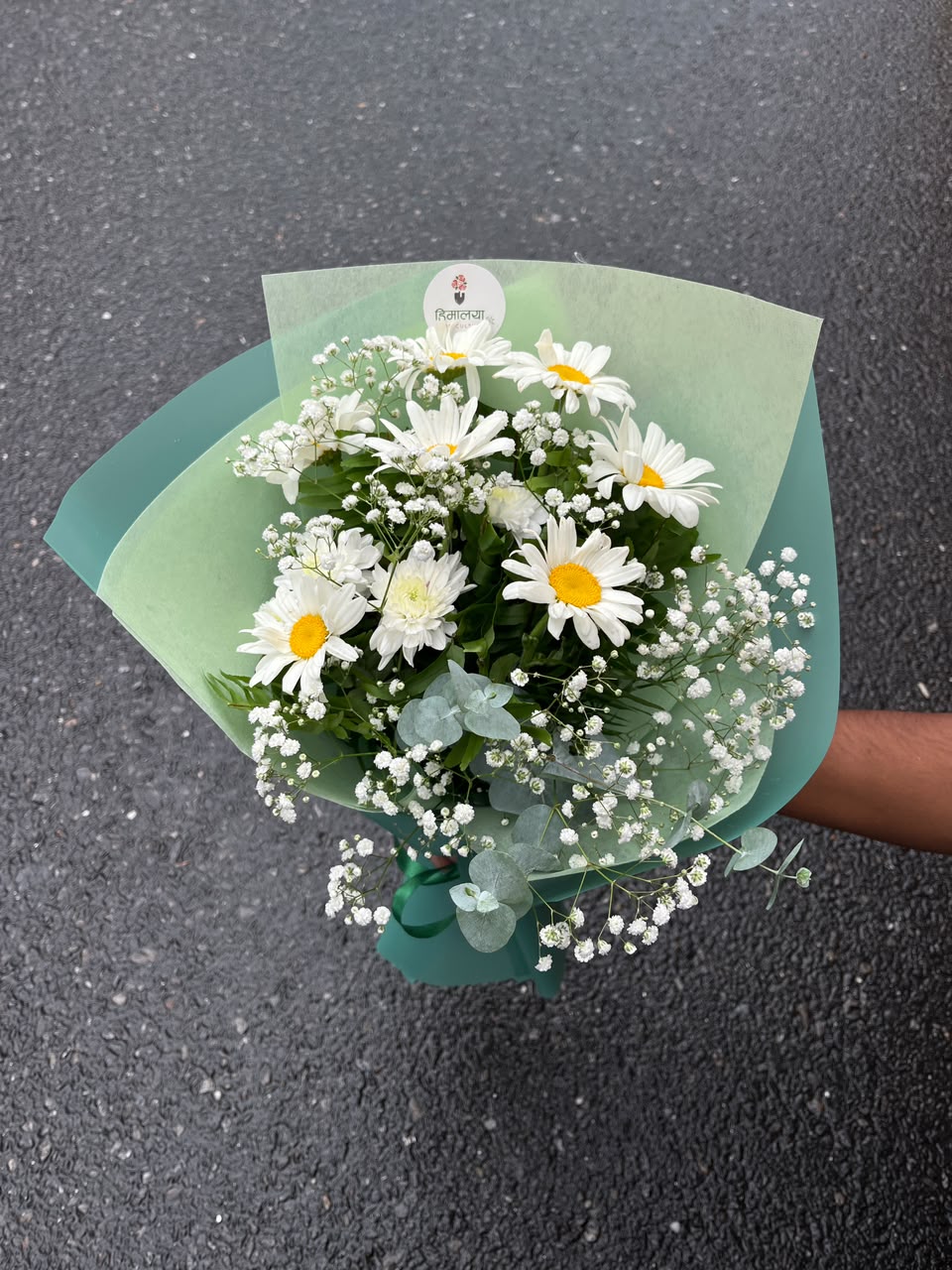 Flower colors, greenery, and arrangement style may vary slightly depending on seasonal availability while maintaining the overall beauty and quality of the bouquet. Keep flowers in fresh water and away from direct sunlight to enjoy longer-lasting freshness.