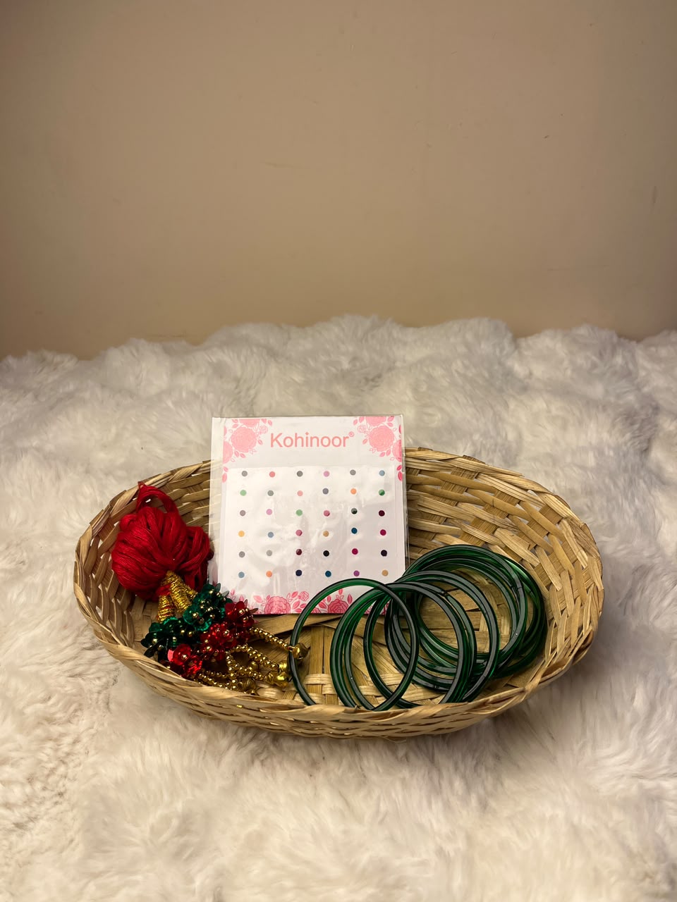 This combo includes a decorative basket as shown. Product colors, designs, and styles of the basket and accessories may vary slightly depending on availability while maintaining the overall quality and value of the combo. This festive basket is ideal for celebrating Shrawan, Teej, and other special occasions or for gifting your loved ones.