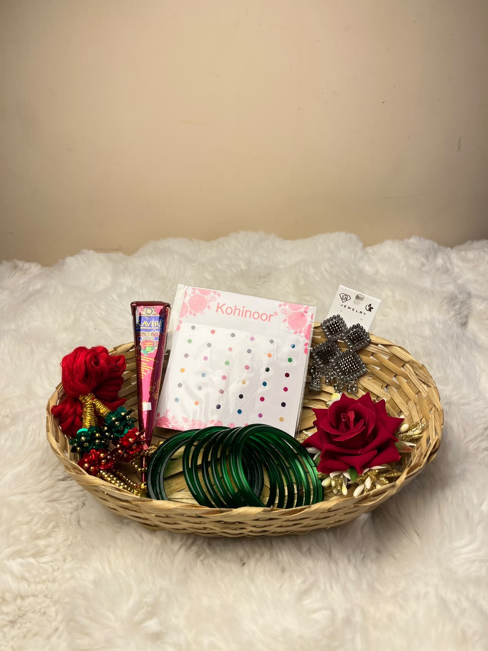 This combo includes a decorative basket as shown. Product colors, designs, and styles of the basket and accessories may vary slightly depending on availability while maintaining the overall quality and value of the combo. Each item is carefully packed to ensure it reaches you in excellent condition. This festive basket is perfect for celebrating Shrawan, Teej, and other special occasions or for gifting your loved ones.