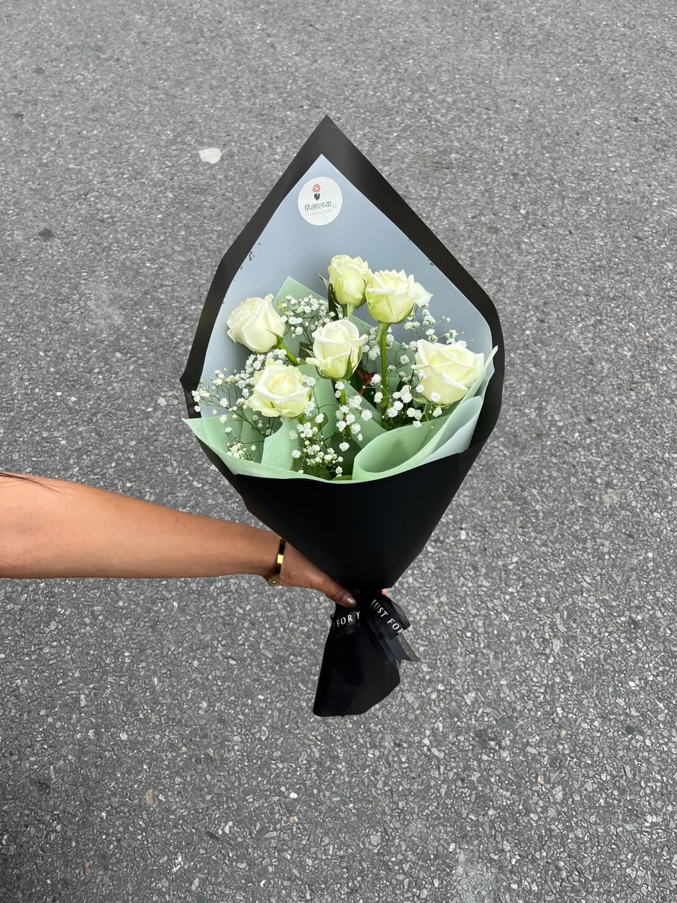 As flowers are natural products, the size, bloom stage, and shades of flowers may vary slightly depending on seasonal availability. The amount and appearance of gypsy fillers may vary while maintaining the bouquet's overall design and elegance. The wrapping style may also differ slightly based on availability while ensuring a premium presentation. To keep the flowers fresh for longer, place them in clean water and keep the bouquet away from direct sunlight and excessive heat.