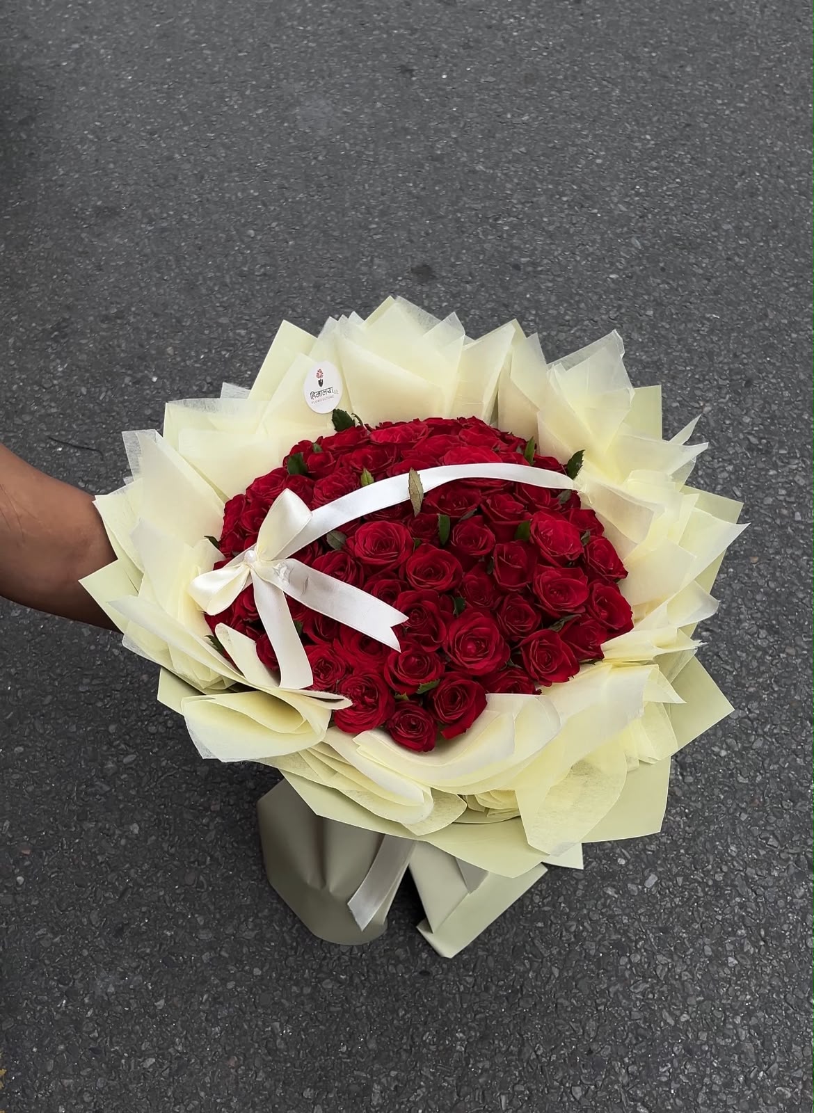 As flowers are natural products, the size, bloom stage, and shades of roses may vary slightly depending on seasonal availability. The cream butter wrapping style and bow design may vary slightly based on availability while maintaining the bouquet's premium appearance and elegant presentation. To keep the roses fresh for longer, place them in clean water and keep the bouquet away from direct sunlight and excessive heat.