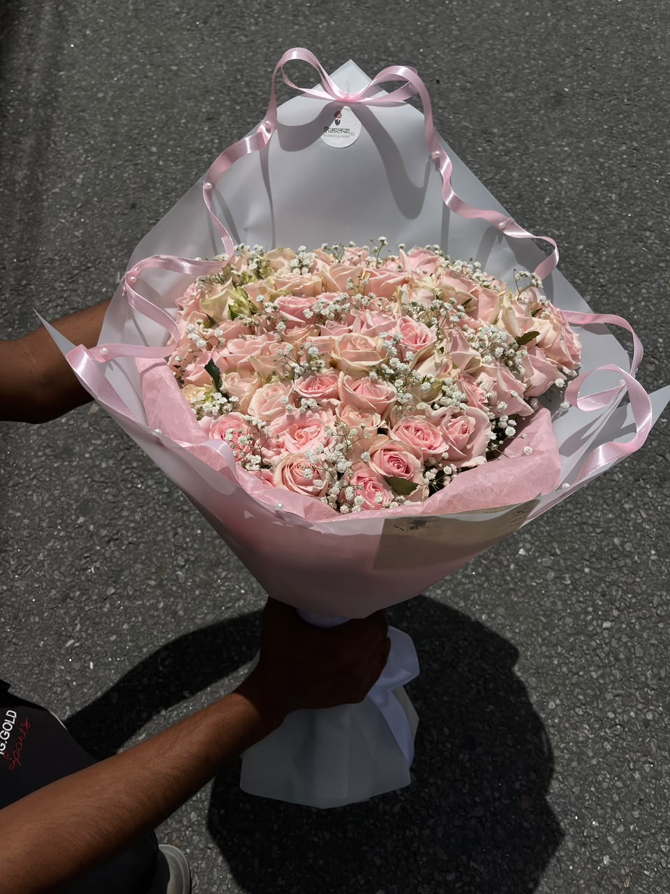 As flowers are natural products, the size, bloom stage, and shades of pastel pink may vary slightly depending on seasonal availability. The arrangement style and wrapping may differ slightly while maintaining the bouquet's premium appearance and overall elegance. To keep the roses fresh for longer, place them in clean water, trim the stems at an angle, and keep the bouquet away from direct sunlight and excessive heat.