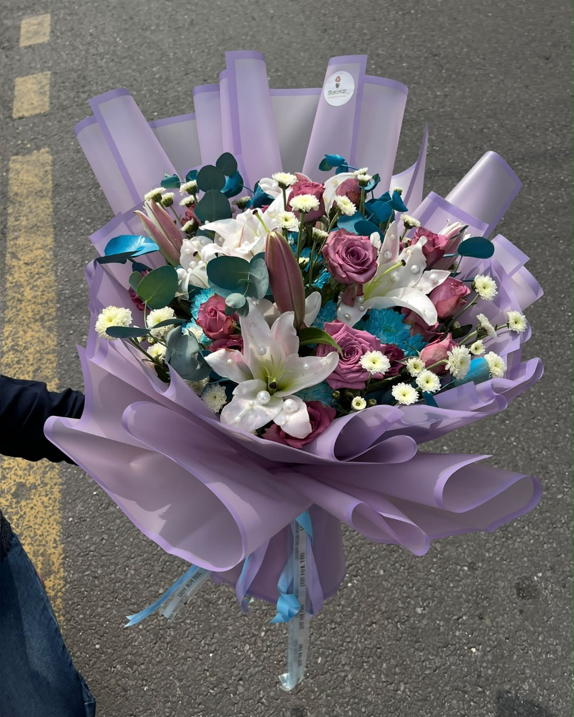 This premium bouquet is carefully arranged with fresh flowers and stylish fillers to create a luxurious gifting experience. Please note that flower colors, availability, and wrapping style may vary slightly depending on seasonal availability while maintaining the same freshness, quality, and overall value.