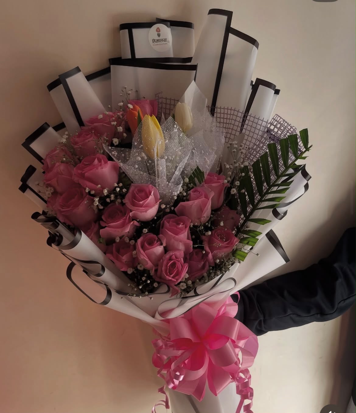 Tulip colors may vary depending on availability. Flower colors and bloom stages may also vary naturally. In case any flower or wrapping material is unavailable, a suitable replacement of similar value and style may be used to maintain the overall beauty and premium presentation of the bouquet.