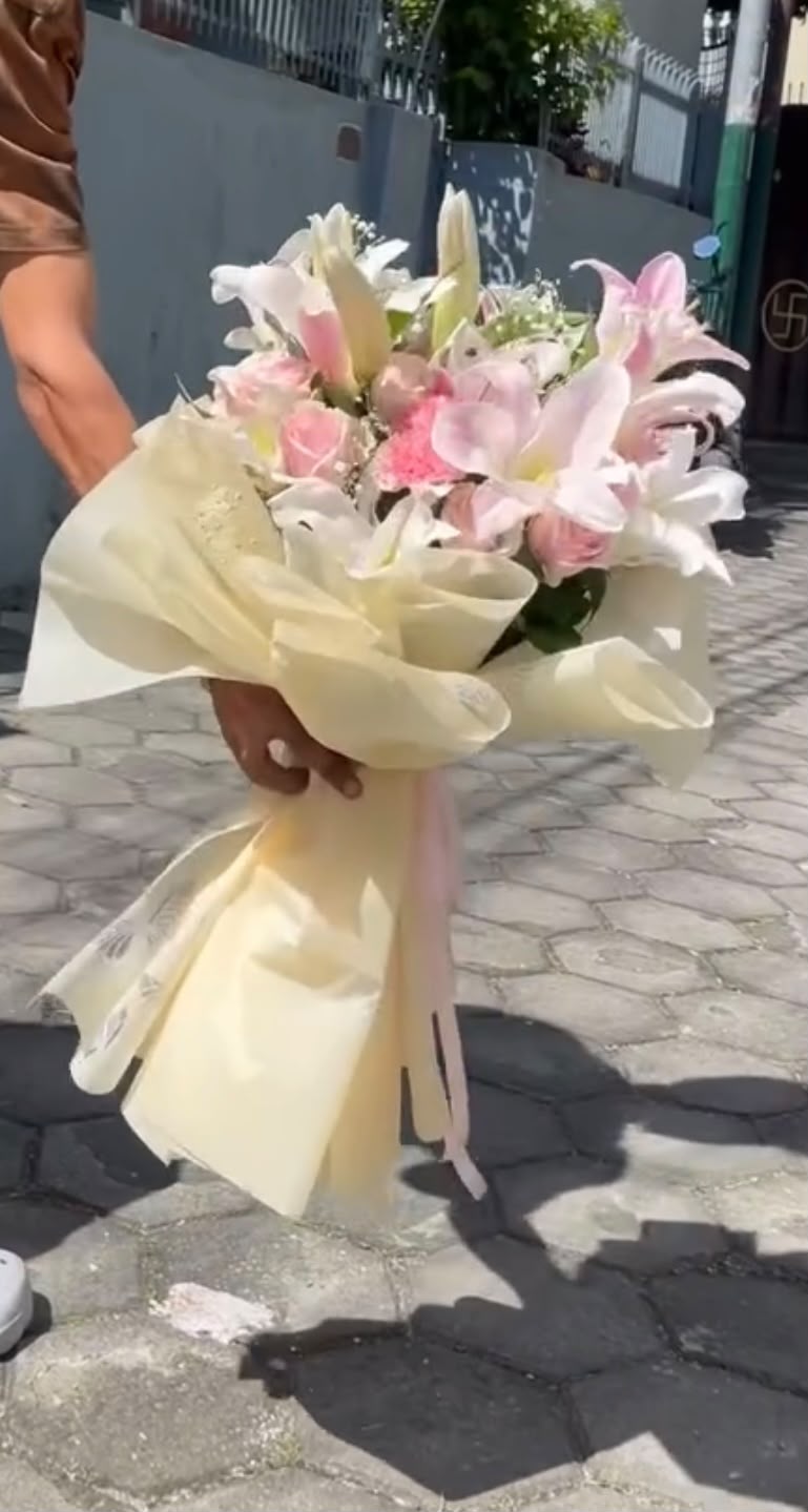 Flower colors and bloom stages may vary depending on availability. In case any flower or material is unavailable, a suitable replacement of similar value and beauty may be used to maintain the overall look and quality of the bouquet.