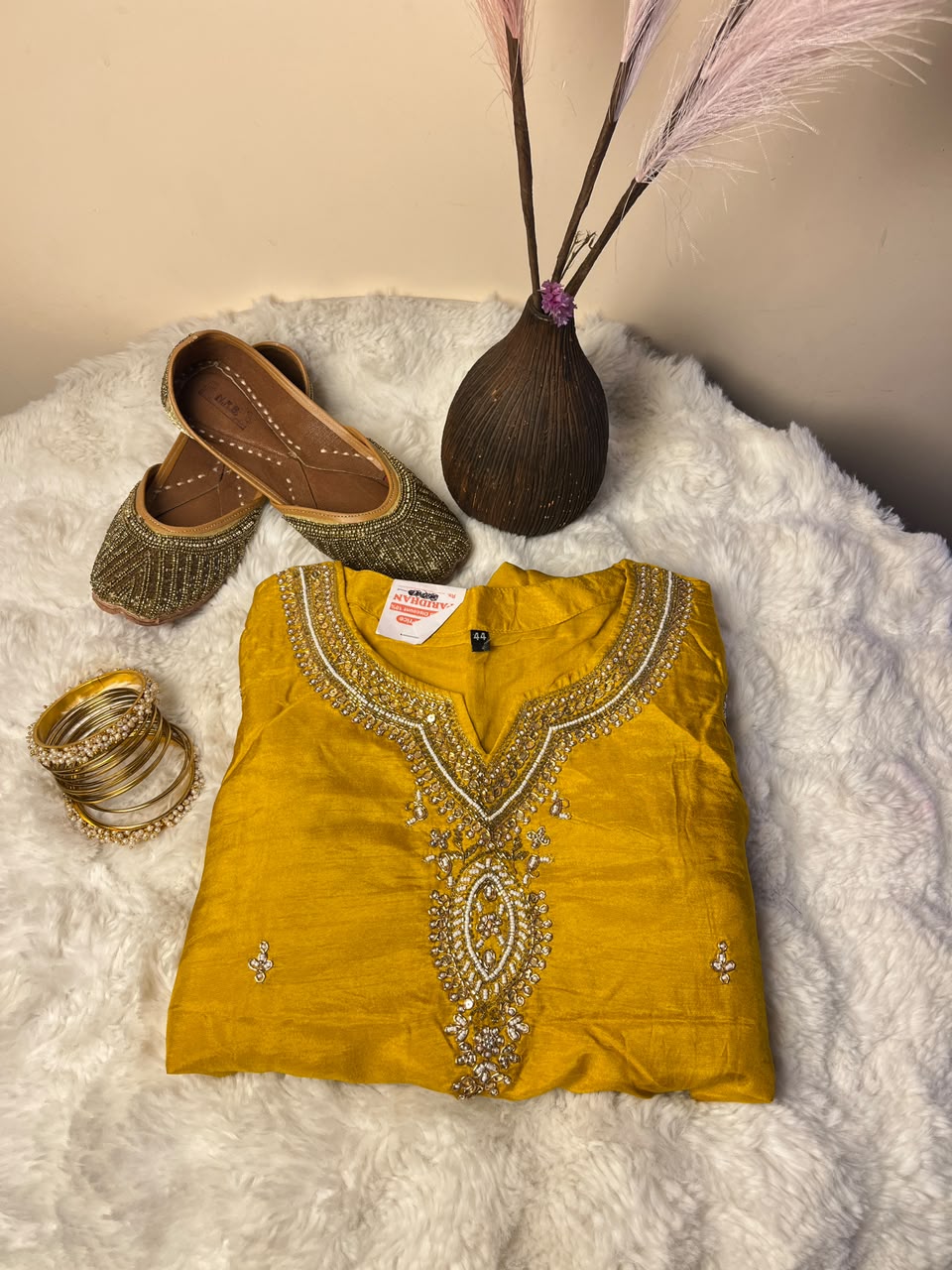 The design, shade, size, and style of the kurtha set, chura, and juttis may vary depending on stock availability. Suitable replacements of equal or greater value will be provided while maintaining the overall quality, festive appeal, and presentation of the gift combo.