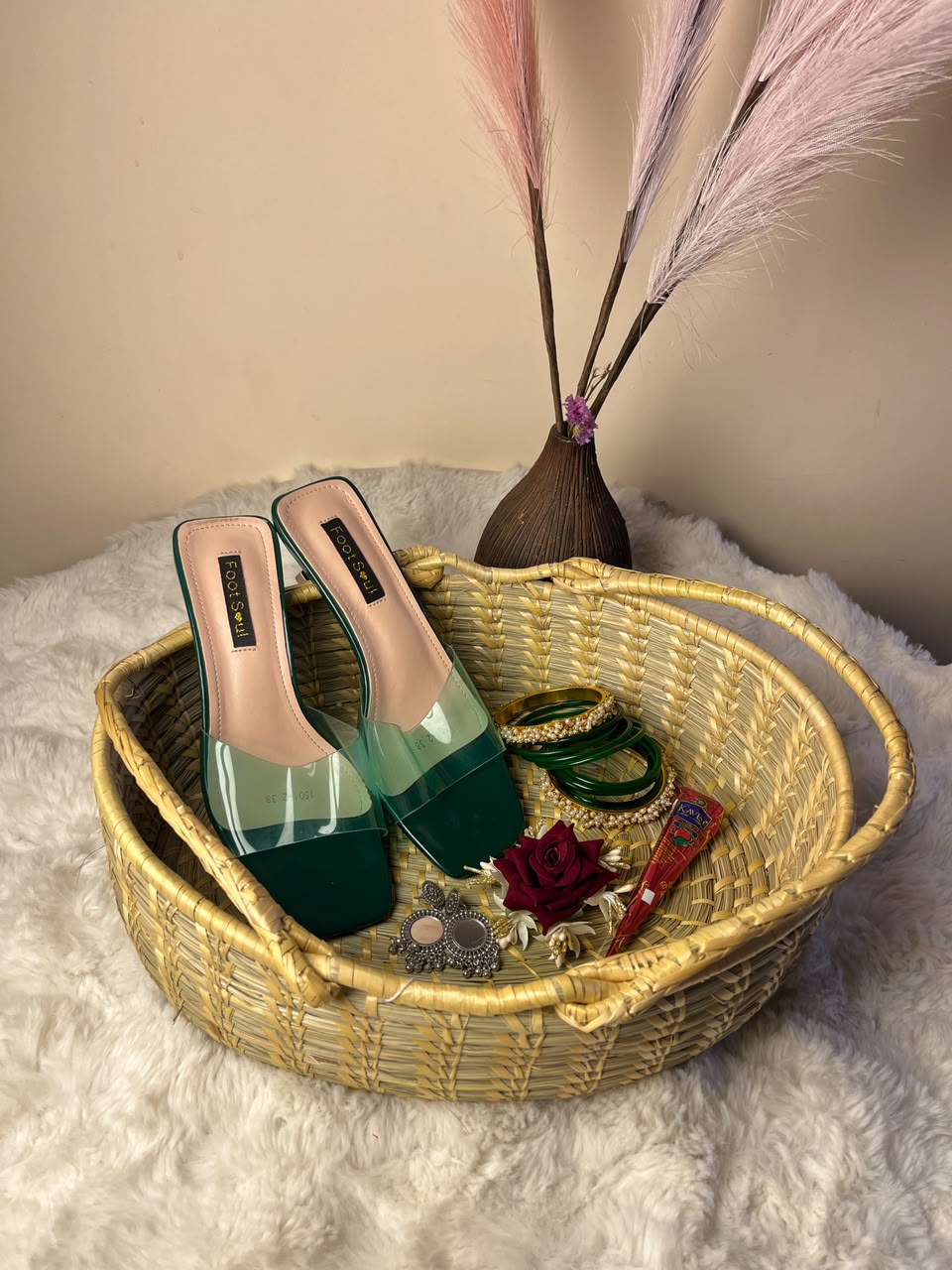 The design, color, size, and style of the sandals, chura, jhumkas, and rose clutcher may vary depending on stock availability. You can mention size in the note. Suitable replacements of equal or greater value will be provided while maintaining the overall quality, festive appeal, and presentation of the gift combo.