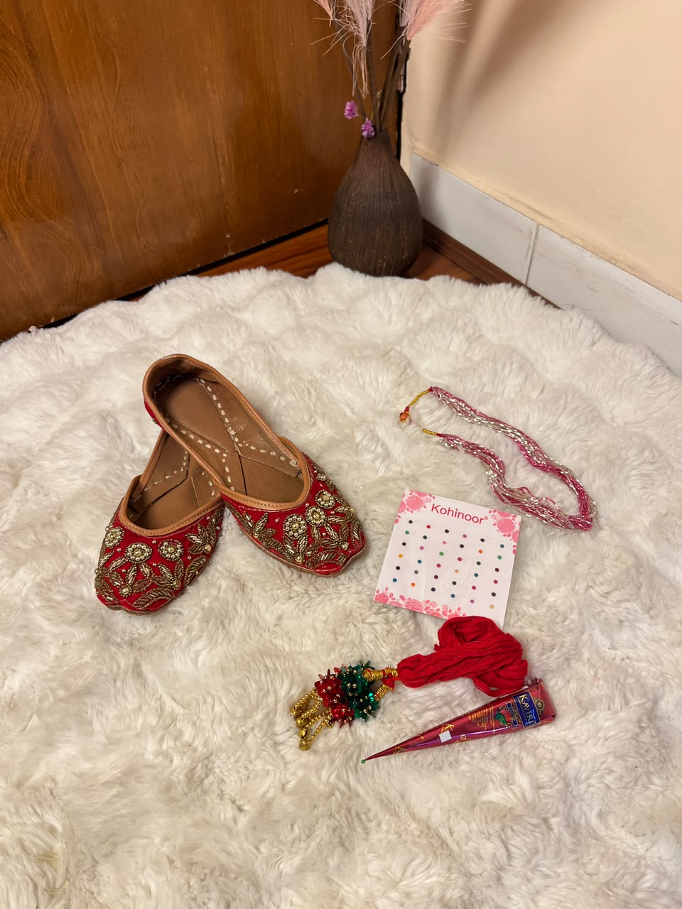 The design, color, size, and style of juttis, laacha dori, tika set, potye mala, and mehendi may vary depending on stock availability. Suitable replacements of equal or greater value will be provided while maintaining the overall traditional look, quality, and presentation of the gift combo.
